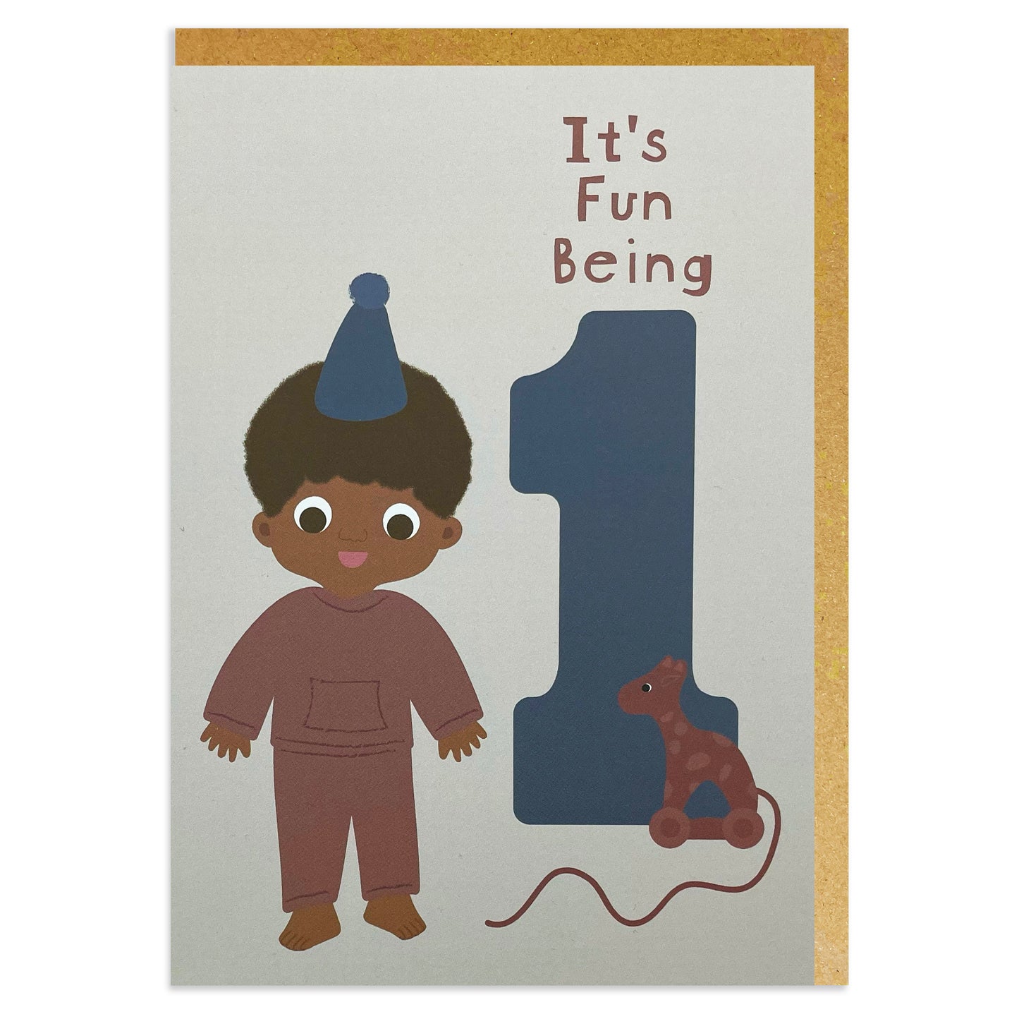 A black birthday card for a 1-year-old Black or mixed-race boy in a colorful party hat, alongside a cute giraffe toy.