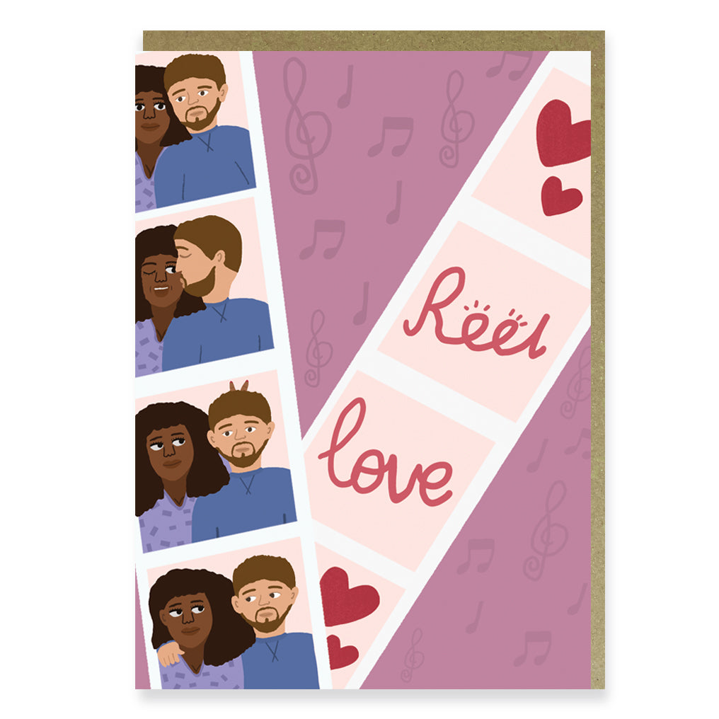 A loved up mixed couple in a photo booth