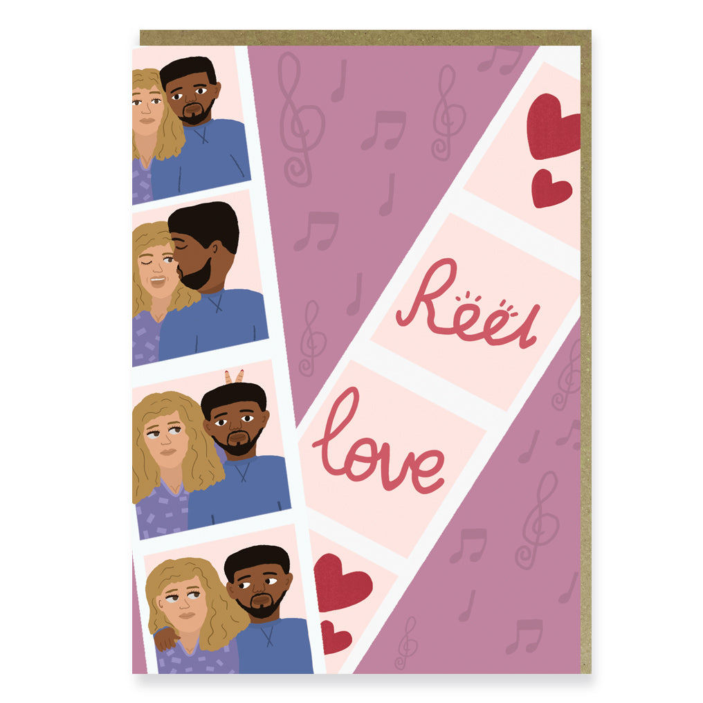 A Valentines Day card showing a loved up mixed race couple in a photo booth